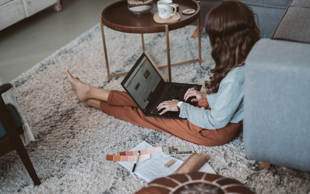 woman sitting on carpet